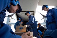 Japan Maritime Self Defense Force personnel load supplies onto a U.S. Marine Corps MV-22B Osprey tiltrotor aircraft assigned to Marine Medium Tiltrotor Squadron (VMM) 265 (Reinforced), 31st Marine Expeditionary Unit (MEU), aboard the JS Hyuga (DDH 181), off the Japanese coast, April 22, 2016.