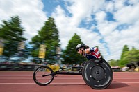 U.S. Army Capt. Kelly Elmlinger takes the lead in a wheelchair race during the 2016 Invictus Games in Orlando, Fla. May 10, 2016. Elminger won a gold medal in the event. (DoD News photo by EJ Hersom). Original public domain image from <a href="https://www.flickr.com/photos/39955793@N07/26797506760/" target="_blank" rel="noopener noreferrer nofollow">Flickr</a>