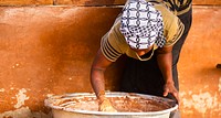 USAID in Ghana: Shea Butter Processing. USAID and the Global Shea Alliance partner to connect West Africa village women to the global marketplace. Photo: Douglas Gritzmacher/USAID. Original public domain image from Flickr