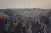 People walk through an IDP camp near the town of Beletweyne, Somalia. Original public domain image from Flickr