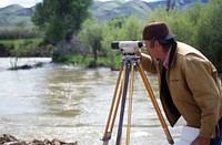 Man surveying along river, EWP on Ruby River, June 1995. Original public domain image from Flickr