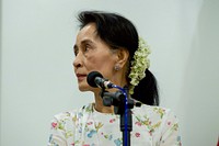 Myanmar Foreign Minister San Suu Kyi Listens to Secretary Kerry Address Reporters during a News Conference following their Bilateral Meeting in Naypyitaw