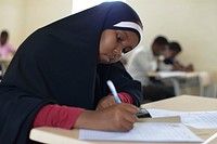 A student sits an exam at SIMAD University, one of the private universities in Mogadishu, Somalia on January 2, 2016. AMISOM Photo / Ilyas Ahmed. Original public domain image from Flickr