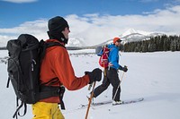 Spring skiing in the Gallatin Range, Montana, USA. NPS photo by Neal Herbert. Original public domain image from Flickr