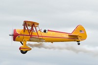 Marcus Paine pilots his 1941 Stearman airplane during the Arctic Thunder Special Needs and Family Day at Joint Base Elmendorf-Richardson, Alaska on July 29, 2016. Original public domain image from Flickr