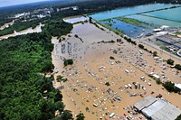 An view from an MH-65 Dolphin helicopter shows flooding and devastation in Baton Rouge, LA on Aug. 15, 2016. U.S. service members have rescued residents and provided relief. Coast Guard photo by Petty Officer 1st Class Melissa Leake. Original public domain image from Flickr