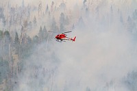 Helicopter support during the Lava Mountain Fire, Shoshone National Forest, Wyoming, July 2016, Martin IMT. (Forest Service photo by Kristen Honig). Original public domain image from Flickr