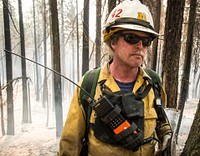 U.S. Department of Agriculture (USDA) Forest Service (FS) Fire and Aviation Management Cooperative Fire Assistant Mark Courson supporting the Adaptive Management Services Enterprise Team (AMSET) Fire Behavior Assessment Team (FBAT) for a site check during Cedar Fire operations in and near the Sequoia National Forest, Posey, CA, on Wednesday, August 24, 2016.