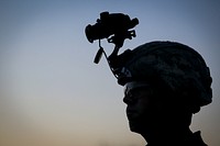 A U.S. Army National Guard Soldier from Charlie Company, 1st Battalion, 114th Infantry Regiment, prepare for a nighttime air assault training mission on Joint Base McGuire-Dix-Lakehurst, N.J., July 18, 2018.