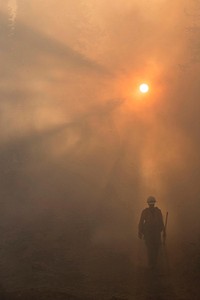 Firefighter going to work through smoke filled environment at the Pioneer Fire. The Pioneer Fire located in the Boise National Forest near Idaho City, ID began on Jul. 18, 2016 and the cause is under investigation.