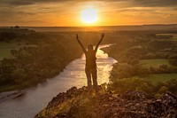 Woman hiked up to top of mountain. Original public domain image from Flickr