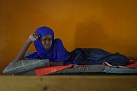 A patient lies in her bed in Barawe hospital in Somalia on August 23, 2016.