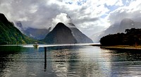 Milford Sound Fiordland NZ. Milford Sound / Piopiotahi is a fiord in the south west of New Zealand's South Island, within Fiordland National Park, Piopiotahi (Milford Sound) Marine Reserve, and the Te Wahipounamu World Heritage site. It has been judged the world's top travel destination in an international survey (the 2008 Travelers' Choice Destinations Awards by TripAdvisor) and is acclaimed as New Zealand's most famous tourist destination. Rudyard Kipling had previously called it the eighth Wonder of the World. Original public domain image from Flickr