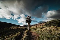 Backpacker hiking in nature. Free public domain CC0 photo.