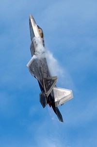 Arctic Thunder Open House 2018A U.S. Air Force F-22 Raptor piloted by a member of the Air Combat Command F-22 Demonstration Team performs aerial maneuvers during the Arctic Thunder Open House at Joint Base Elmendorf-Richardson, Alaska, June 30, 2018. This biennial event hosted by JBER is one of the largest in the state and one of the premier aerial demonstrations in the world. The event features multiple performers and ground acts to include the JBER joint forces, U.S. Air Force F-22 and U.S. Air Force Thunderbirds demonstrations teams, June 30-July 1. (U.S. Air Force photo by Alejandro Peña). Original public domain image from Flickr