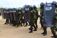 Police officers from the Darwish Police Unit in the Jubbaland State of Somalia demonstrate tactics and skills learned during a training on public order management at Darwish Police Academy in Kismayo on July 3, 2018.