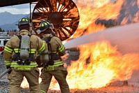 Fire protection specialists Tech Sgt. Sean Armstrong, left, and Senior Airman Larry Kyles. Original public domain image from Flickr