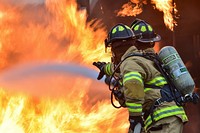 Fire protection specialists Tech Sgt. Sean Armstrong, and Senior Airman Larry Kyles, assigned to the 673rd Civil Engineer Squadron. Original public domain image from Flickr