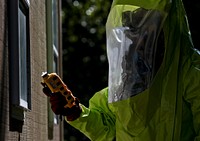 U.S. Air National Guard Staff Sgt. Seth Schoenfeld walks through a simulated "hot zone" searching for contaminates during Exercise Clean House, an Emergency Management response evaluation, Joint Base McGuire-Dix-Lakehurst, N.J., Sept. 14, 2016.