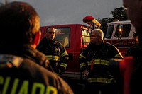 Firefighters are briefed prior to live burn training at the Anthony "Tony" Canale Training Center in Egg Harbor Township, N.J., Sept. 18, 2018. New Jersey state and Delaware Air National Guard firefighters teamed up with civilian instructors for the training that focused on fire suppression in small structures. (U.S. Air National Guard photo by Master Sgt. Matt Hecht). Original public domain image from Flickr