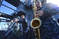 MEDITERRANEAN SEA (Oct. 9, 2016) Petty Officer 2nd Class Marc Heskett, right, a musician from the Naval Forces Europe Band&acirc;s New Orleans brass band, Topside, rehearses on the flight deck of the U.S. 6th Fleet command and control ship USS Mount Whitney (LCC 20) Oct. 9, 2016.
