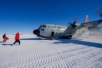 Secretary Kerry Walks Towards an Idling U.S. Air Force C- 130 Cargo Plane at Williams Skiway in Antarctica