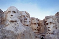 Mount Rushmore National Memorial is a massive sculpture carved into Mt. Rushmore in the Black Hills region of South Dakota. Completed under the direction of Gutzon and Lincoln Borglum from 1927–1941, the sculpture's roughly 60-ft.-high granite faces depict U.S. presidents George Washington, Thomas Jefferson, Theodore Roosevelt and Abraham Lincoln. The site also features a museum with interactive exhibits. Original public domain image from Flickr