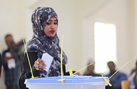 A delegate casts her vote during the electoral process to choose members of the Lower House of the Federal Parliament in Garowe, Puntland, Somalia on November 13, 2016. AMISOM Photo. Original public domain image from <a href="https://www.flickr.com/photos/au_unistphotostream/30658829800/" target="_blank" rel="noopener noreferrer nofollow">Flickr</a>