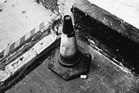 Old street cone, black and white tone. Original public domain image from Flickr