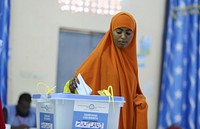 A delegate casts her vote during the electoral process to choose members of the Lower House of the Federal Parliament in Garowe, Puntland, Somalia on November 13, 2016. AMISOM Photo. Original public domain image from Flickr