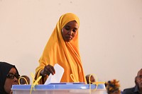 A delegate casts her vote during the electoral process to choose members of the Lower House of the Somali federal Parliament in Garowe, Somalia on November 23, 2016. AMISOM Photo / Barut Mohamed. Original public domain image from <a href="https://www.flickr.com/photos/au_unistphotostream/31094569411/" target="_blank" rel="noopener noreferrer nofollow">Flickr</a>