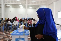 A delegate from Somaliland votes during the ongoing electoral process in Mogadishu, Somalia, on December 19, 2016. UN Photo / Ilyas Ahmed. Original public domain image from Flickr