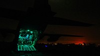 Aerial porters and 737th Expeditionary Airlift Squadron Airmen prepare a C-130H Hercules for cargo in Iraq, Dec. 15, 2016.