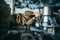 170105-N-KT595-133 - Aviation Structural Mechanic 2nd Class Kyle Miller, assigned to Helicopter Sea Combat Squadron 85 (HSC 85) aboard Naval Air Station North Island, Coronado, Calif., conducts flight control maintenance on one of the squadron’s HH60-H aircraft.