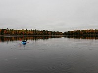 Take in the peace and quiet (and fall colors) from your kayak at Emily Lake campground near Lac Du Flambeau, WI on the Medford-Park Falls Ranger District. (Forest Service photo). Original public domain image from Flickr