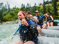 Kayla Cureton,Mike Bylund and Jason Condie catch a refreshing wave as April Todd sets them up for the next wave on the Bridger-Teton Natinal Forest East of Alpine, Wyoming July 14, 2018. Forest Service photo by Nate Lowe. Original public domain image from Flickr