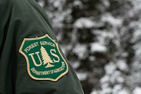 U.S. Department of Agriculture (USDA) Forest Service (FS) uniform embroidered shield seen at the Apache-Sitgreaves National Forests area near Big Lake in the Apache National Forest, 25 miles southwest of Eagar, AZ on Dec 6, 2018.