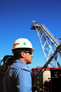 A Day in the Life of an InspectorBSEE Lead Inspector Sammy Viola oversees inspections of temporary equipment, while gas is flared in the background at the top of a flare stack on Front Runner. Original public domain image from Flickr