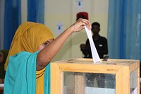 A delegate casts her vote during a rerun of one of the nullified seats for South West state in Baidoa, Somalia on February 2, 2016. AMISOM Photo / Abdikarim Mohamed. Original public domain image from <a href="https://www.flickr.com/photos/au_unistphotostream/32305110880/" target="_blank" rel="noopener noreferrer nofollow">Flickr</a>