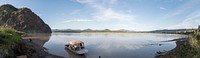 Panorama of Yukon River from the banks in Eagle, Alaska. Eagle bluff pictured on the left.NPS Photo / Sean Tevebaugh 2016. Original public domain image from Flickr