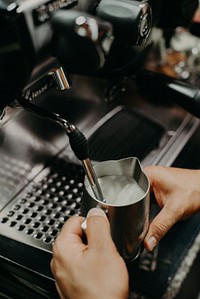 Barista frothing milk. Free public domain CC0 photo.