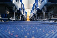 Empty seat, plane aisle. Free public domain CC0 photo.