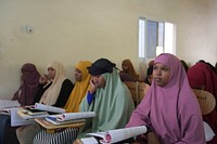 Students of Mogadishu University attend a lecture at the university campus in Somalia on April 30, 2017. AMISOM Photo / Ilyas Ahmed. Original public domain image from Flickr