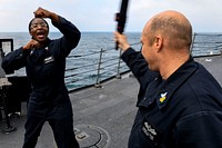 BLACK SEA (May 9, 2017) - Quartermaster 2nd Class Lakendra Brown, from St. Petersburg, Florida, uses a high block to deflect a blow from Master-at-Arms 1st Class Damon Rudd, from Bremerton, Washington, during a security reaction force basic qualification course aboard the Arleigh Burke-class guided-missile destroyer USS Oscar Austin (DDG 79), May 9, 2017.
