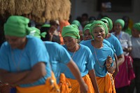 A group of Nigerian women take part in a dance during celebrations to mark Africa Day held at the AMISOM headquarters in Mogadishu, Somalia, on May 25, 2017. AMISOM Photo. Original public domain image from Flickr