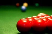 Close up red pool balls on pool table. Original public domain image from Flickr