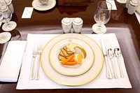 A simple plate of cheese, crackers and carrots is set for for the table setting. Original public domain image from Flickr