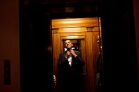 President Barack Obama rides the elevator to the Private Residence of the White House after attending 10 inaugural balls and a long day, including being sworn in as President, Jan. 20, 2009.