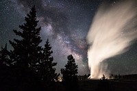 Old Faithful erupts under a clear summer sky. Original public domain image from Flickr