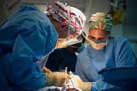MEDITERRANEAN SEA (July 11, 2017) Lt. Cmdr. Krista Puttler, left, ship&#39;s surgeon aboard the aircraft carrier USS George H.W. Bush (CVN 77), and Hospital Corpsman 1st Class Christina Sizemore cauterize an incision after a surgical operation.